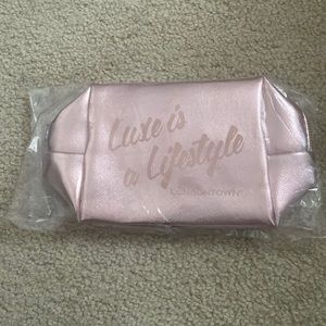 Shiny pink make up bag